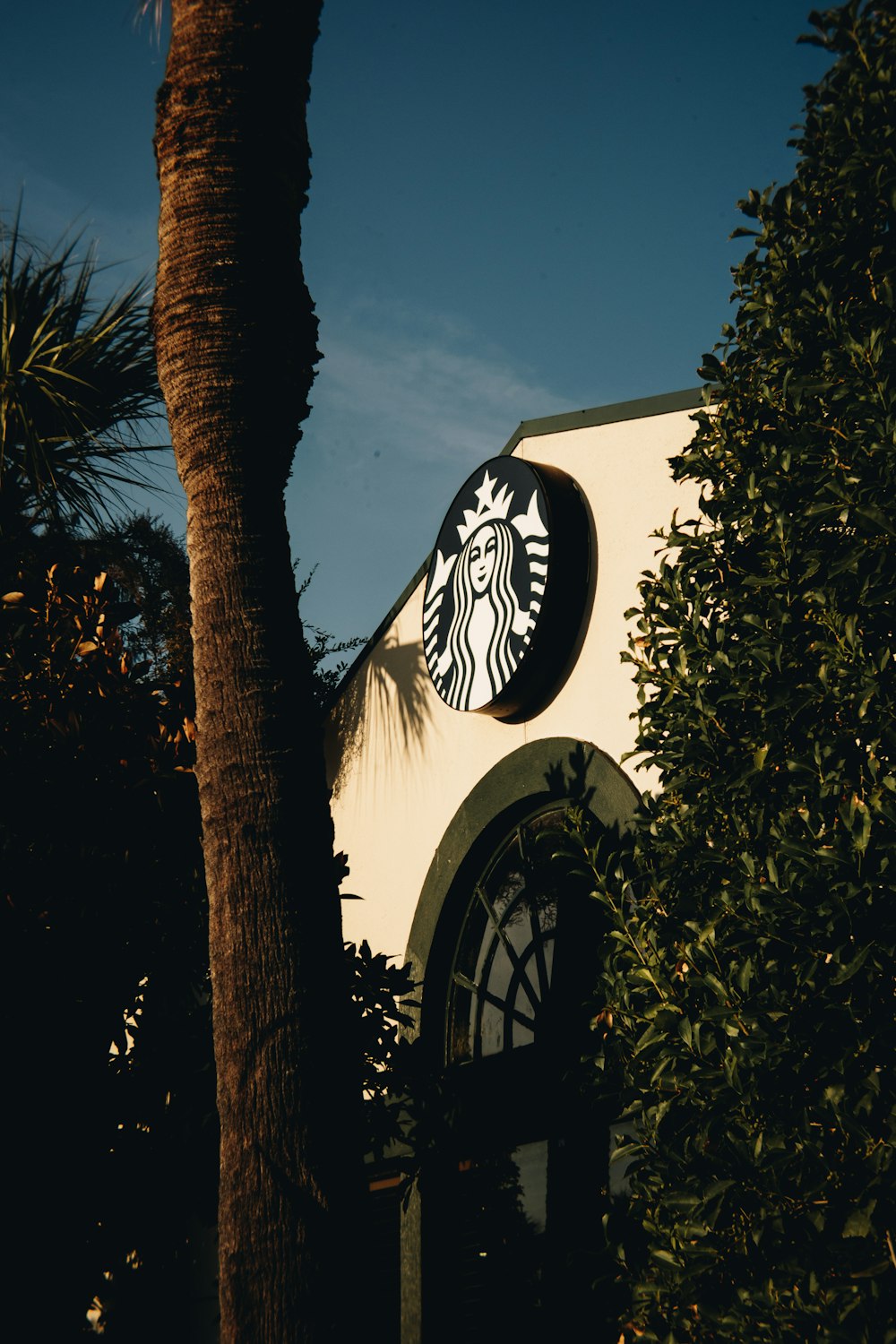 a starbucks sign on the side of a building