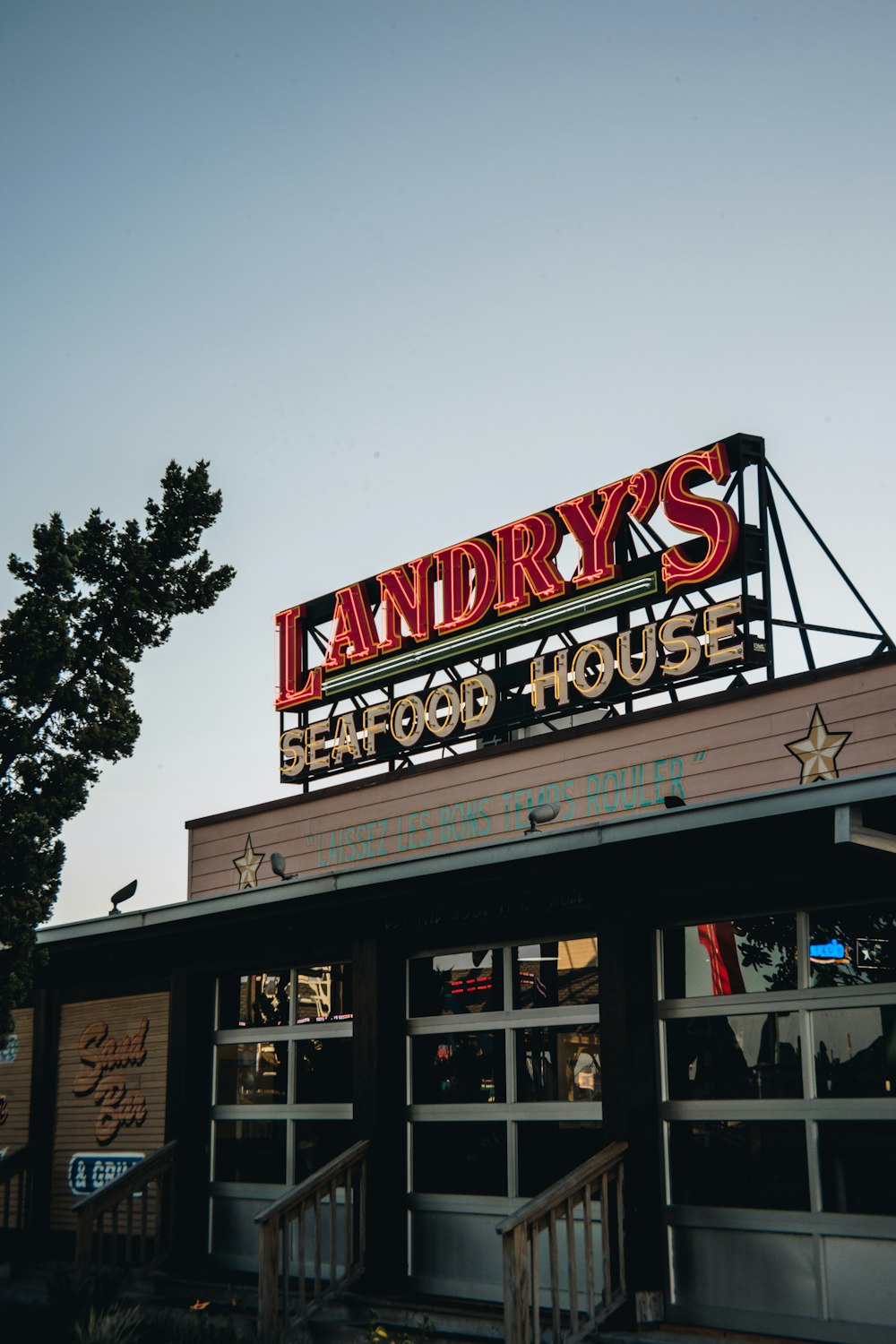 a restaurant with a large sign on the roof