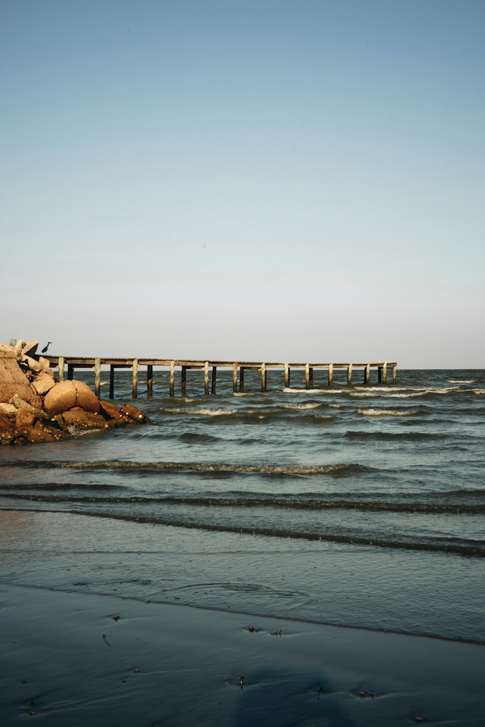 a long wooden pier over a body of water