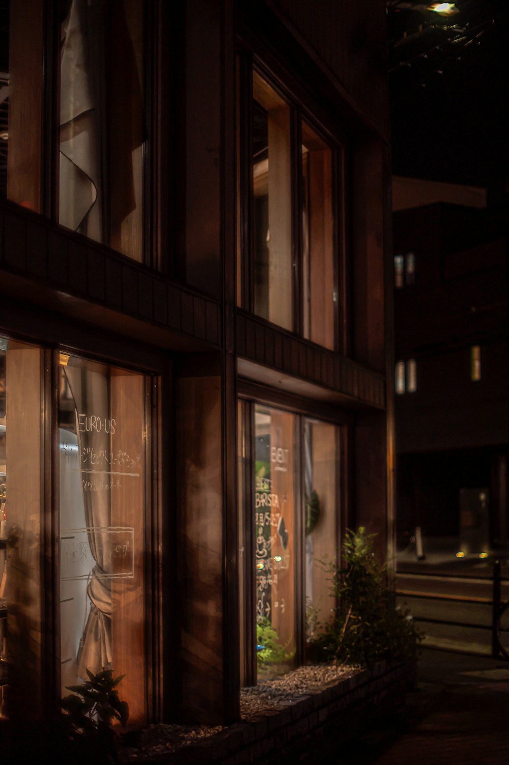 a store front at night with the lights on