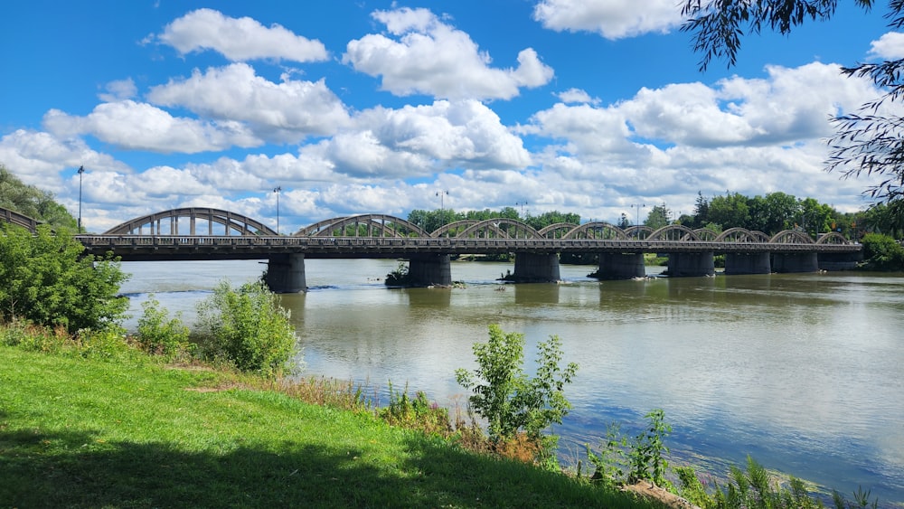 a bridge over a river on a sunny day