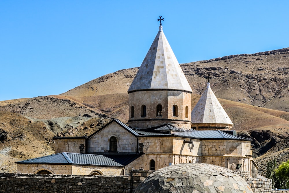 a church in the middle of a mountain range