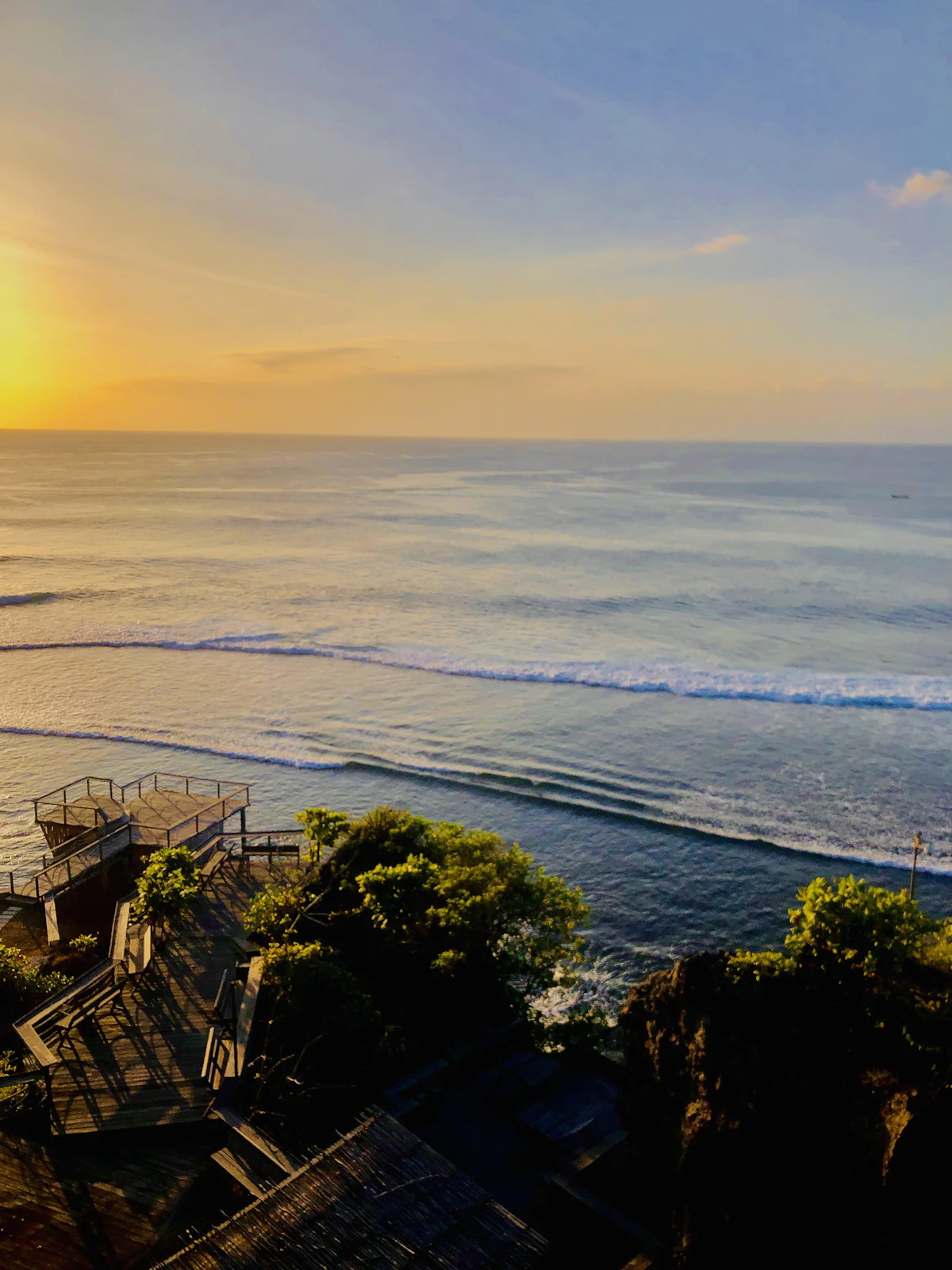 Reef break shoreline and clifftop sunset vantage points along Bingin Beach