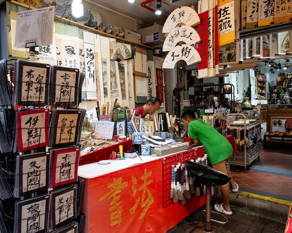 a man sitting at a counter in a store