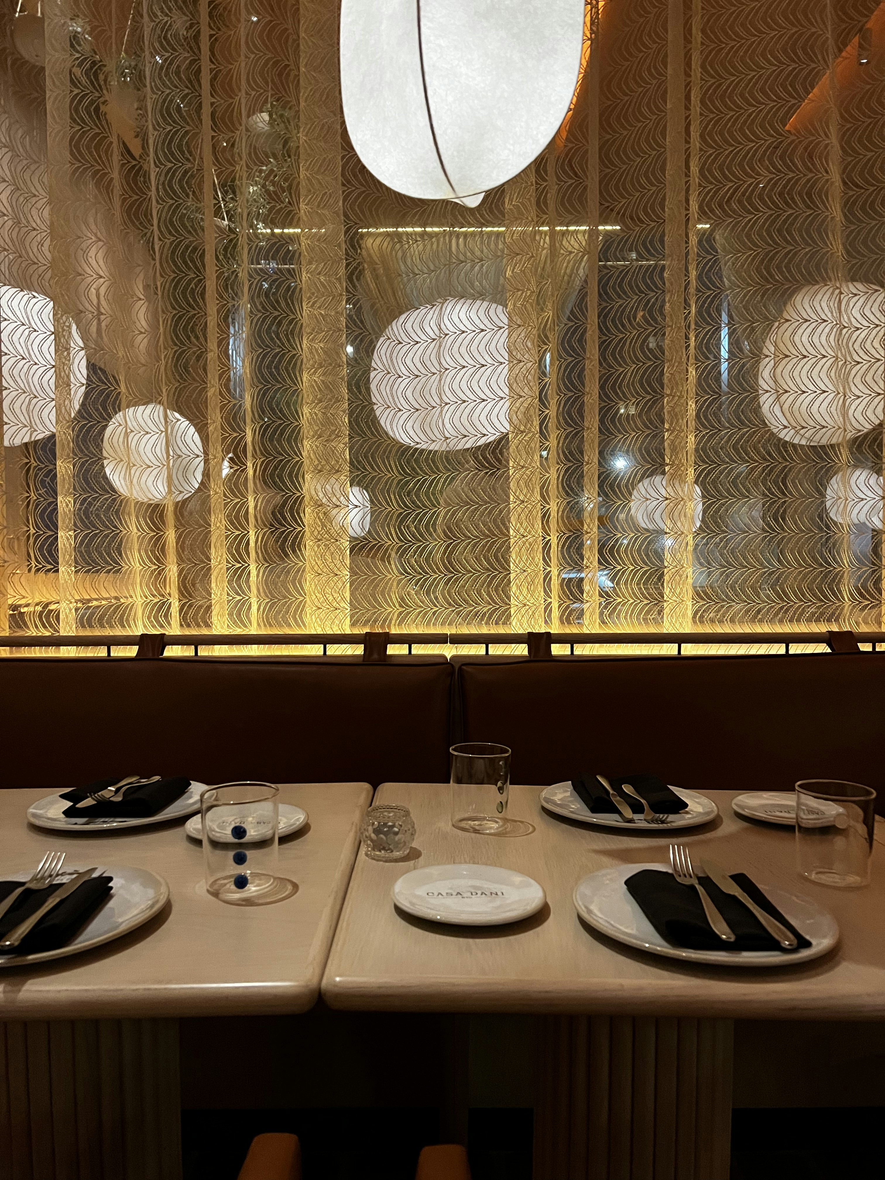 A stylish dining area with elegant furniture and table settings.