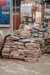 a pile of books sitting on top of a table