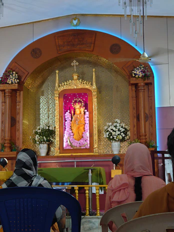 A serene altar adorned with traditional Candomblé offerings and vibrant flowers under soft natural light.