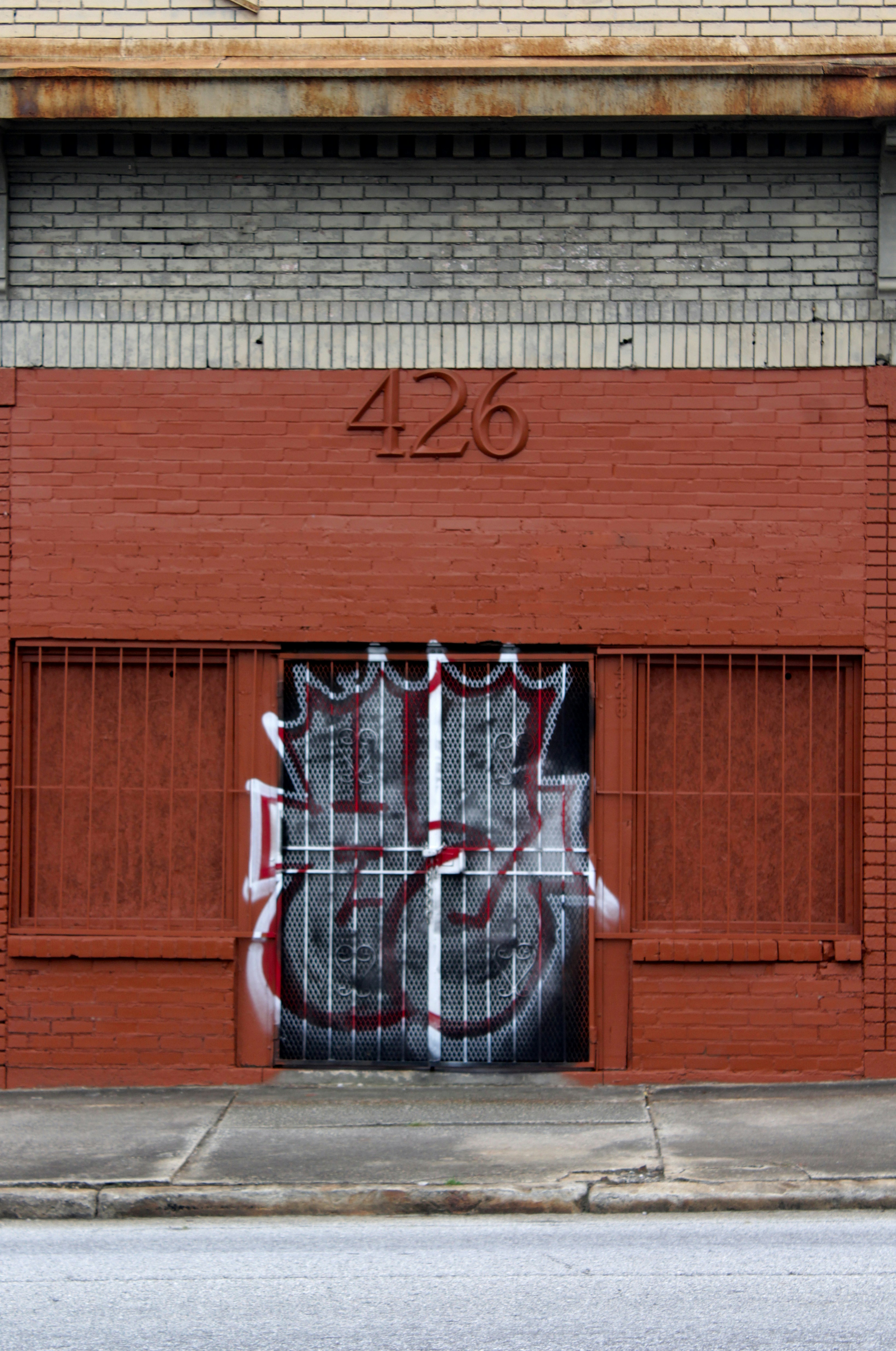Red brick building with street graffiti in East Atlanta