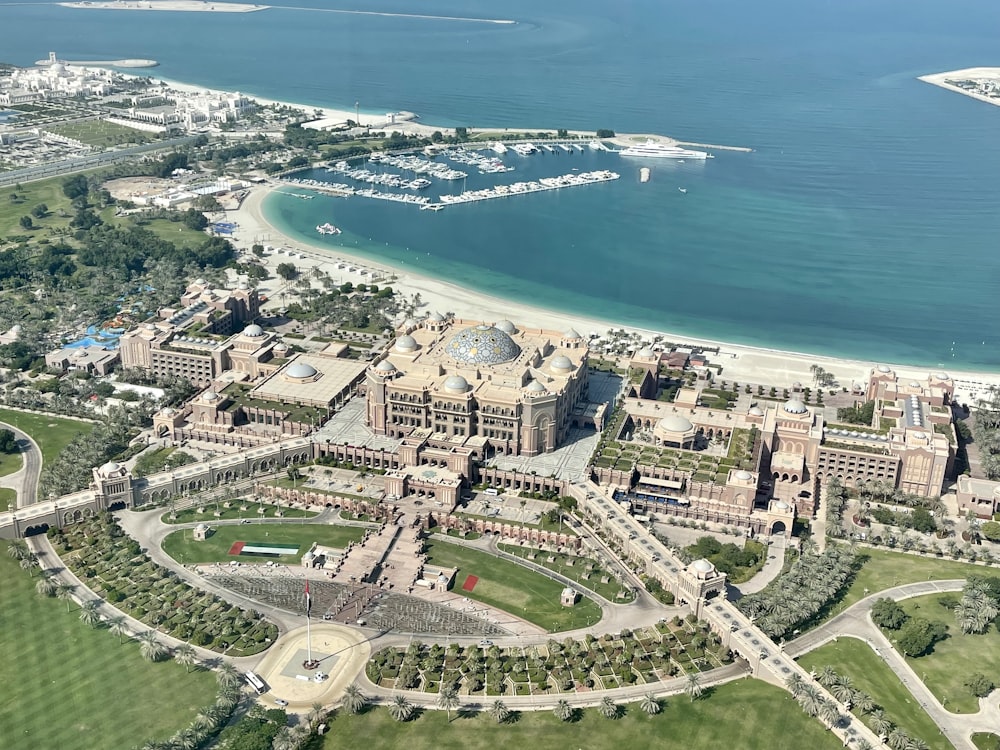 an aerial view of a large building in the middle of a body of water