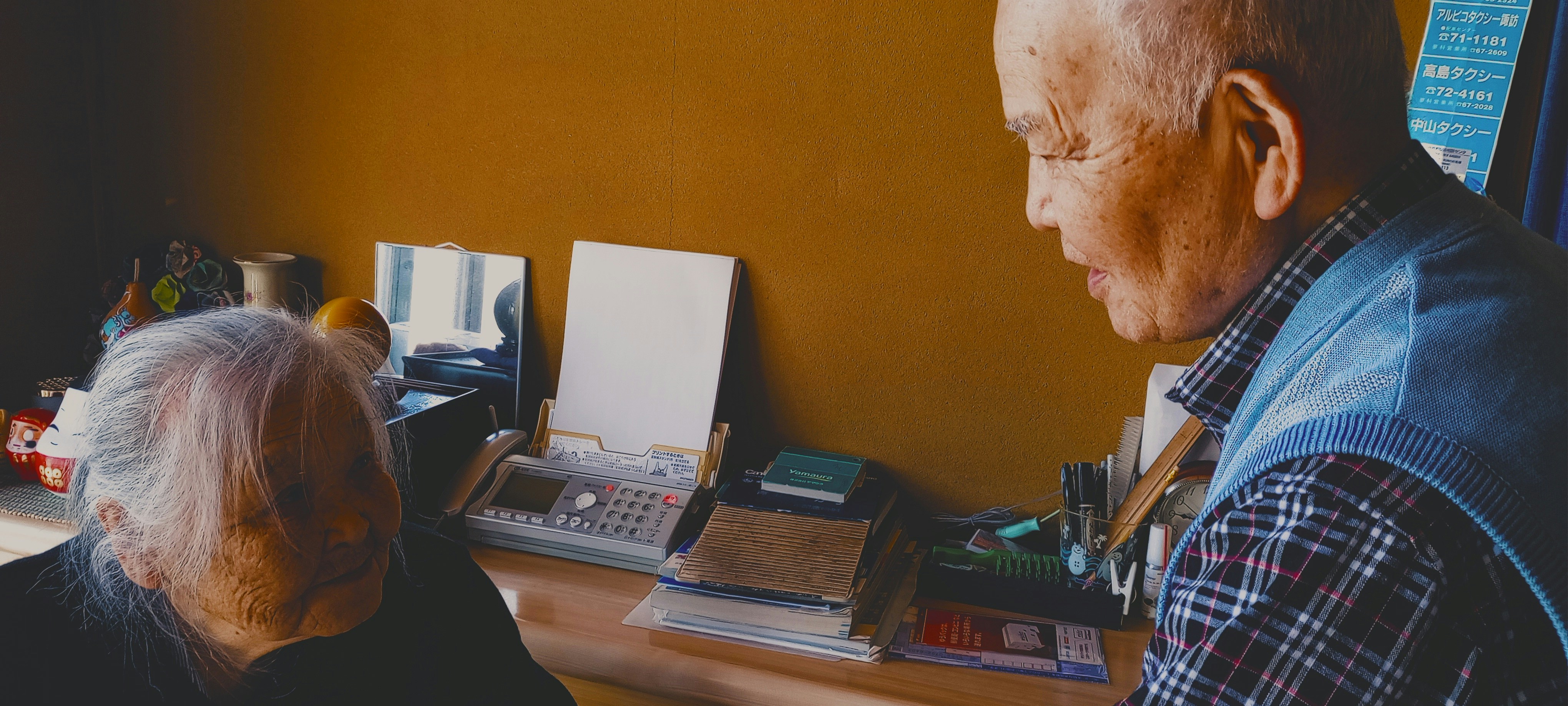 a man and a woman sitting at a desk