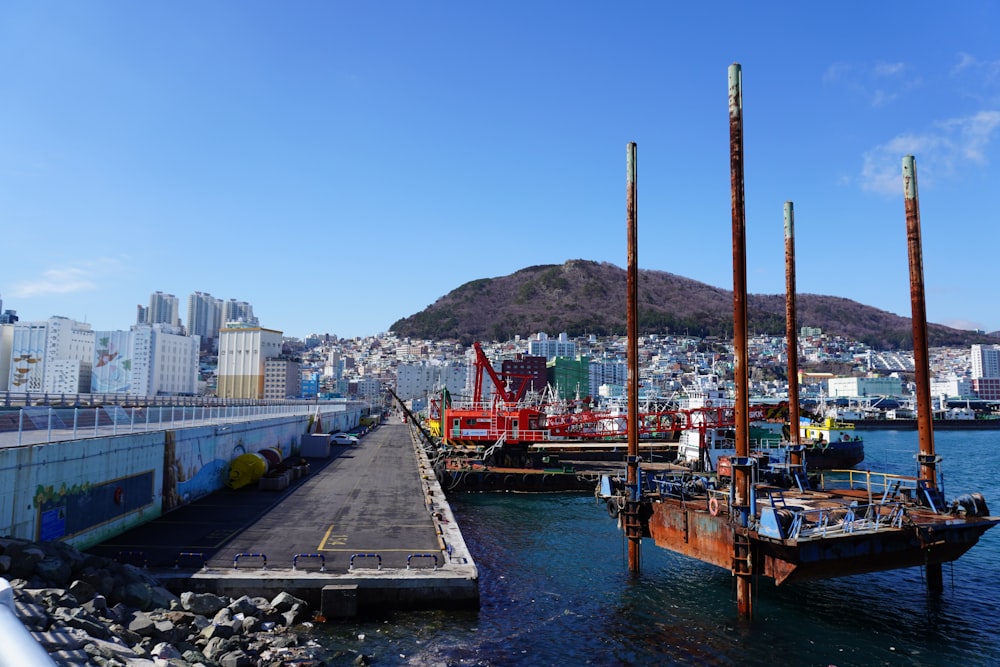 a boat dock with a few boats in the water