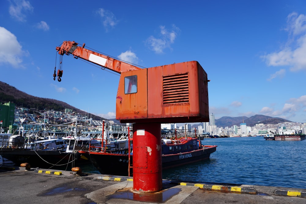 a crane is on top of a boat in the water