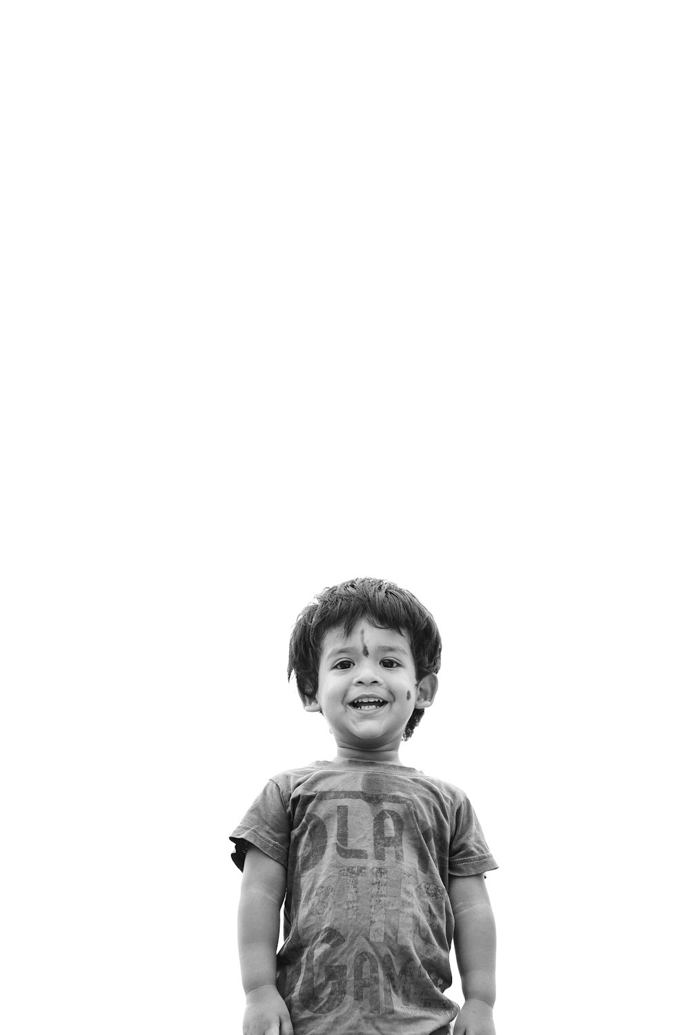 a black and white photo of a young boy