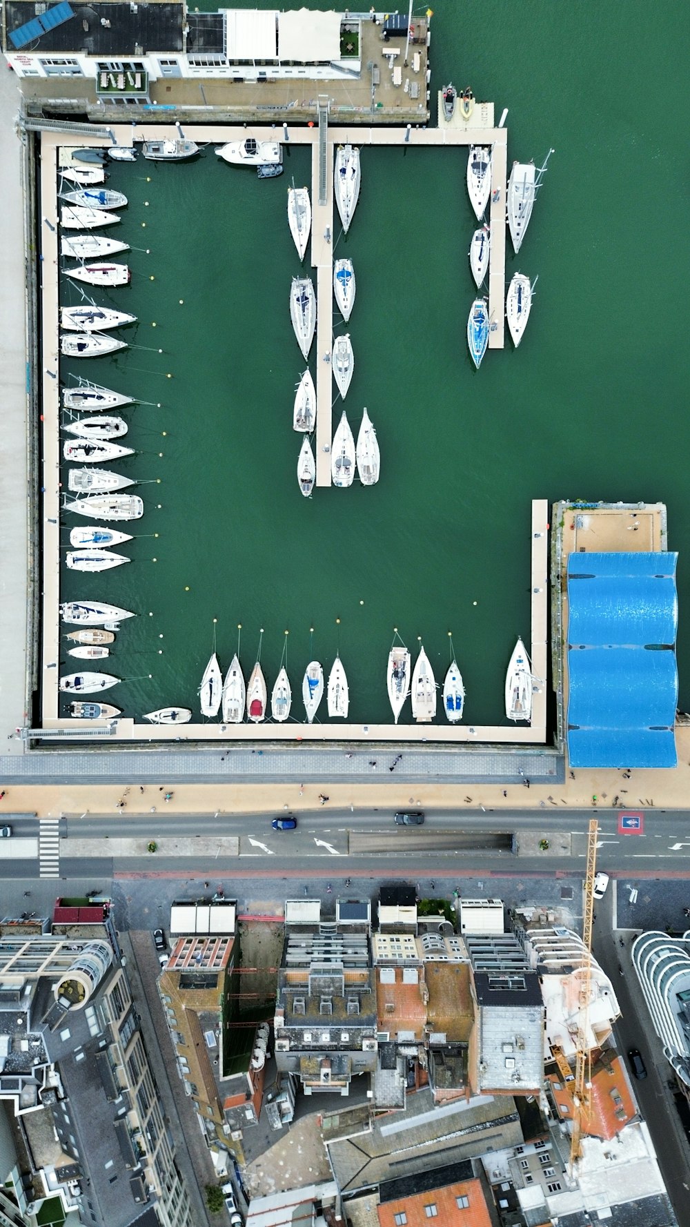 an aerial view of boats docked at a marina