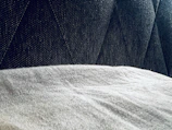 Close-up of premium upholstery fabric samples in various colors and textures