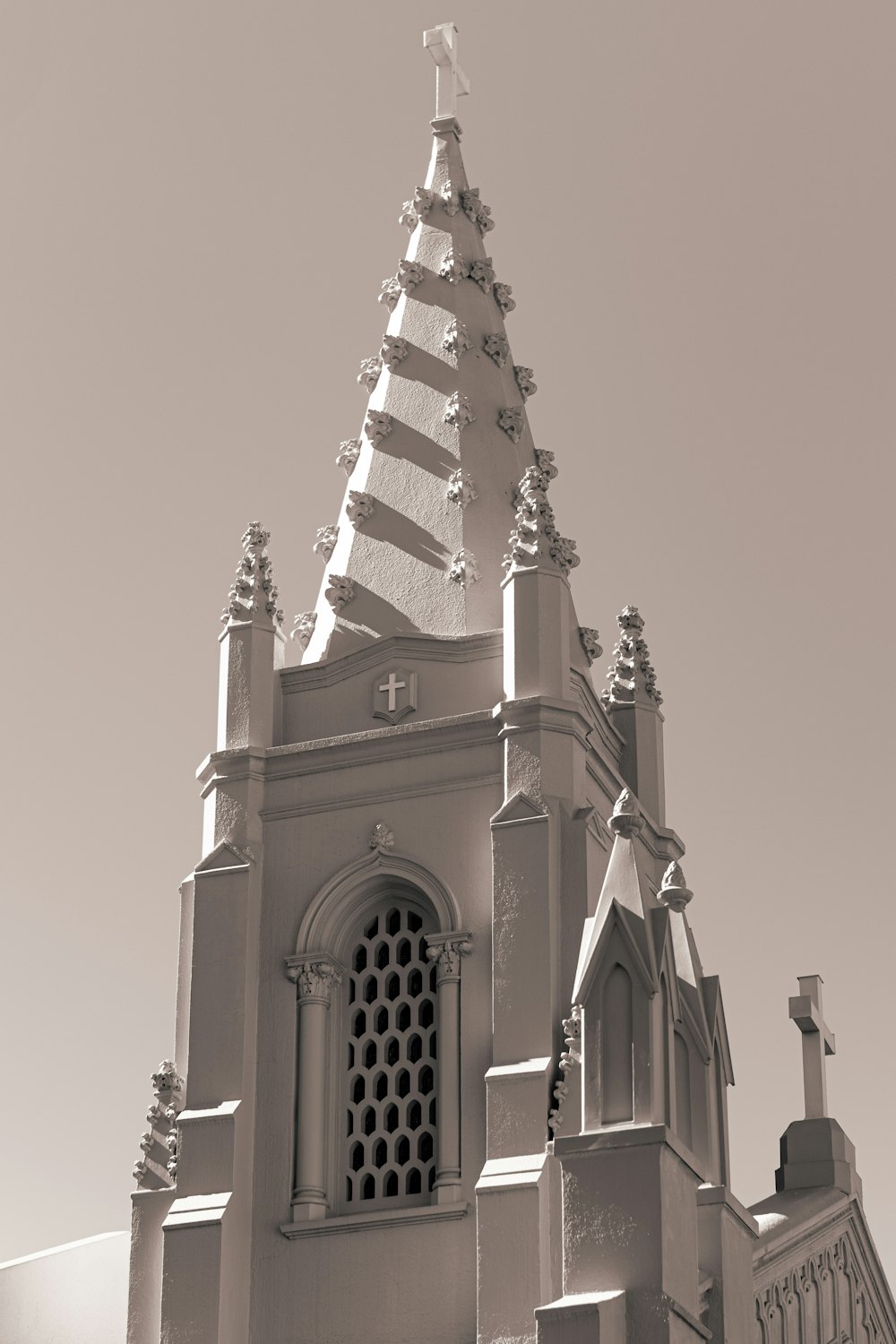 a black and white photo of a church steeple