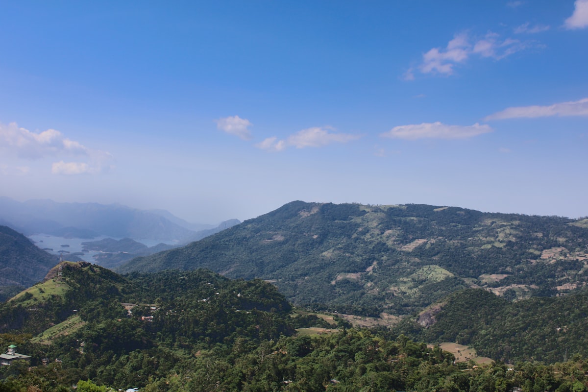a view of a mountain range with a lake in the distance