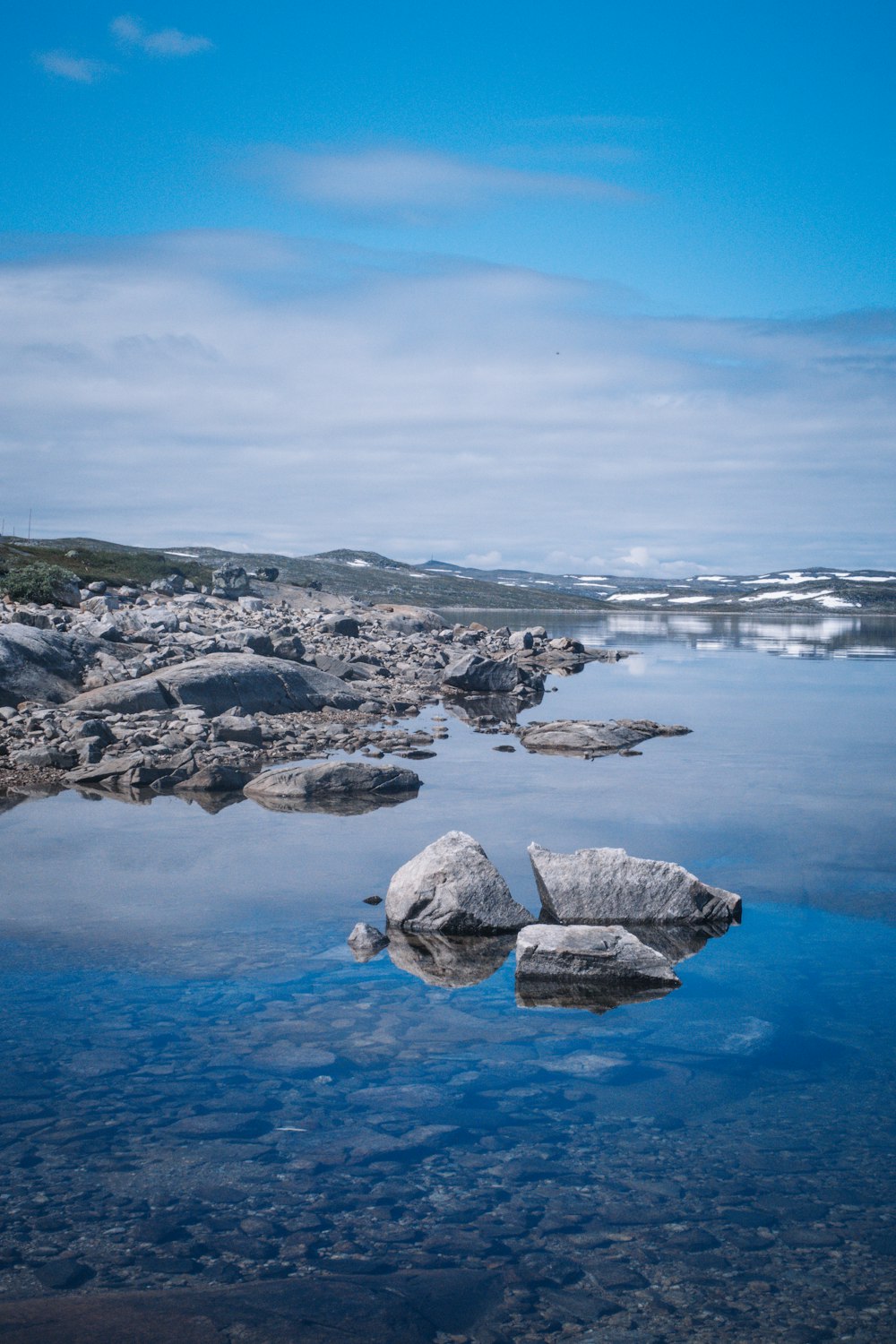 a body of water with rocks in it