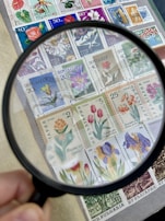 A digital screen showcasing multimedia scans of rare collectible stamps in high resolution.