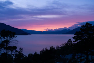 A serene landscape print featuring soft pastel skies over a calm lake, evoking peaceful moments.