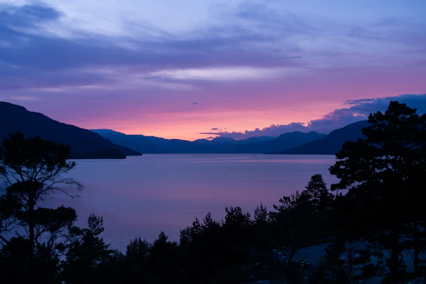 A serene landscape print featuring soft pastel skies over a calm lake, evoking peaceful moments.