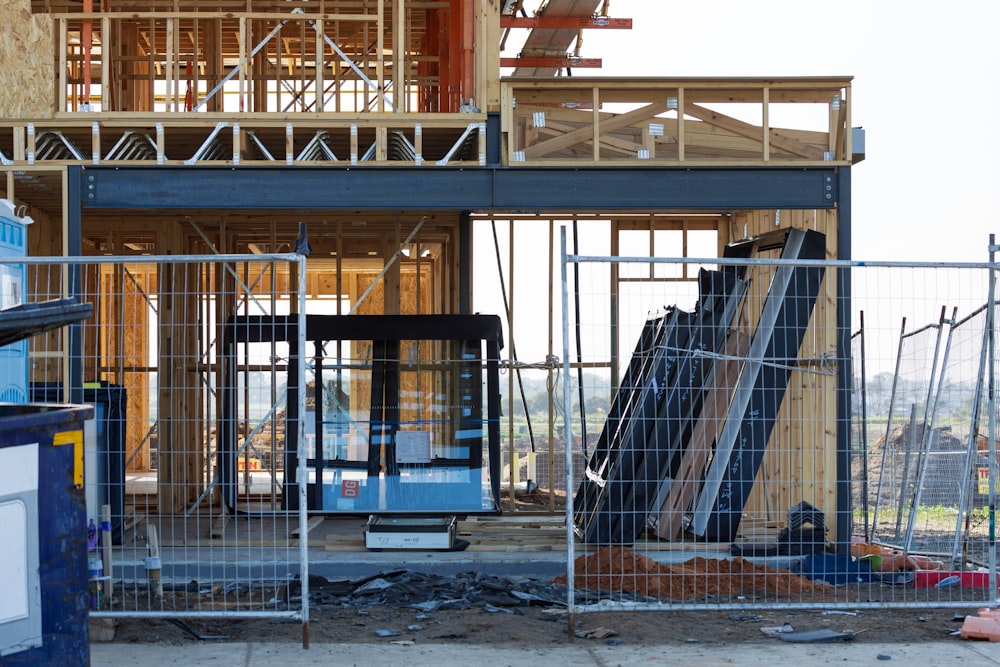 a building under construction with a crane in the background