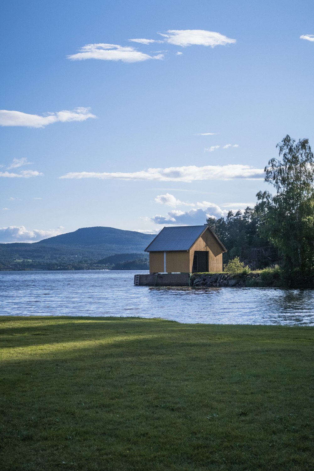 a small house sitting on top of a body of water