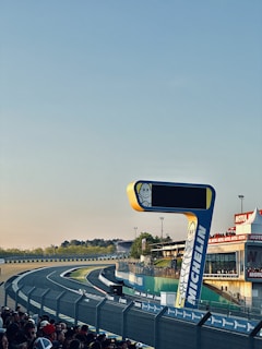 Photo of a branded event organized by Lacouronne Services with sponsors and fans.