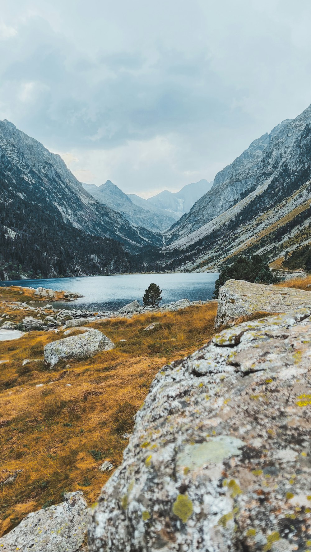 a view of a mountain lake from a rocky outcropping