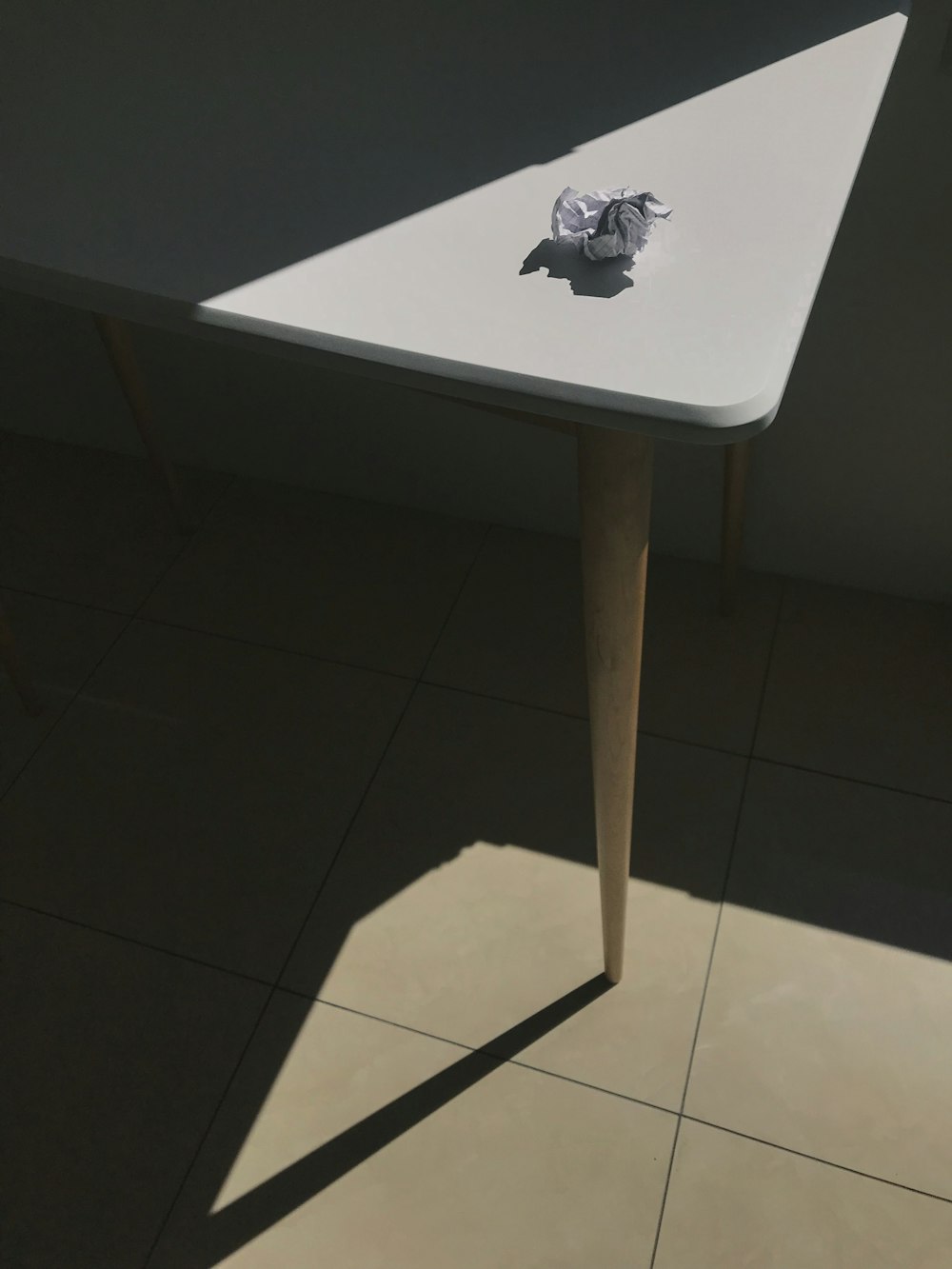 a white table with a piece of paper on top of it