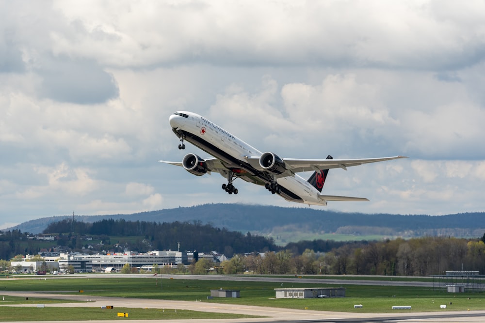 a large jetliner taking off from an airport runway