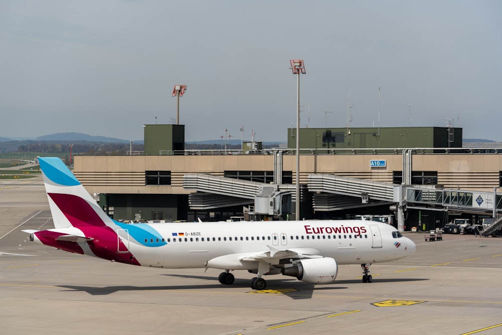 a large passenger jet sitting on top of an airport tarmac