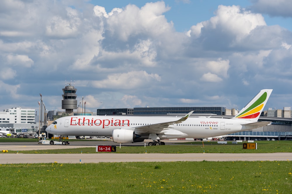 a large jetliner sitting on top of an airport runway