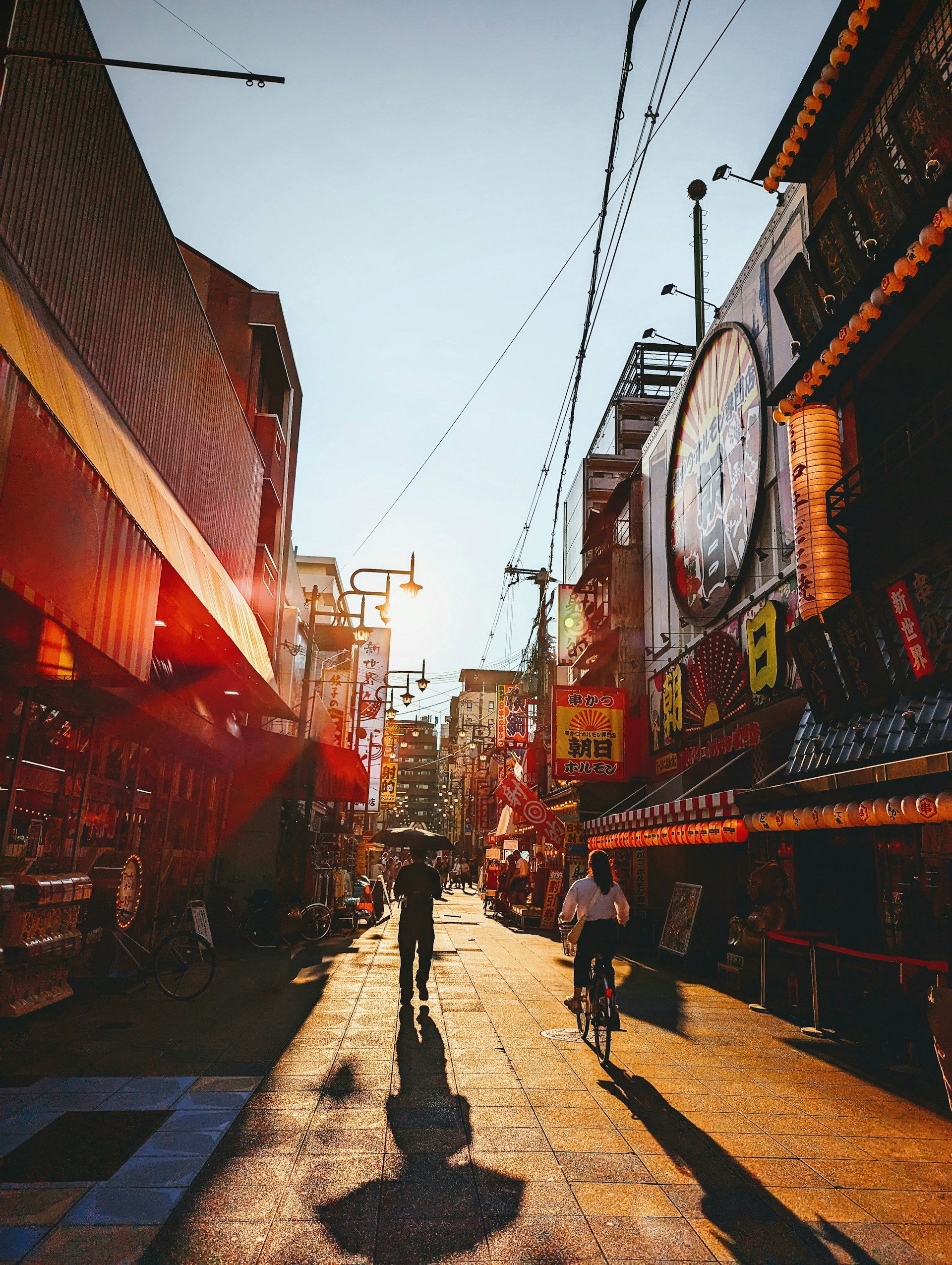 A vibrant still from a documentary film showing a lively street scene filled with natural light and authentic emotions.