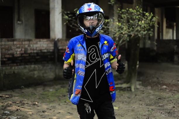 Satisfied customer shaking hands with a Performansmoto technician beside a tuned vehicle.