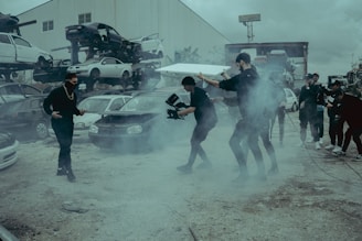 a group of people standing around in a parking lot