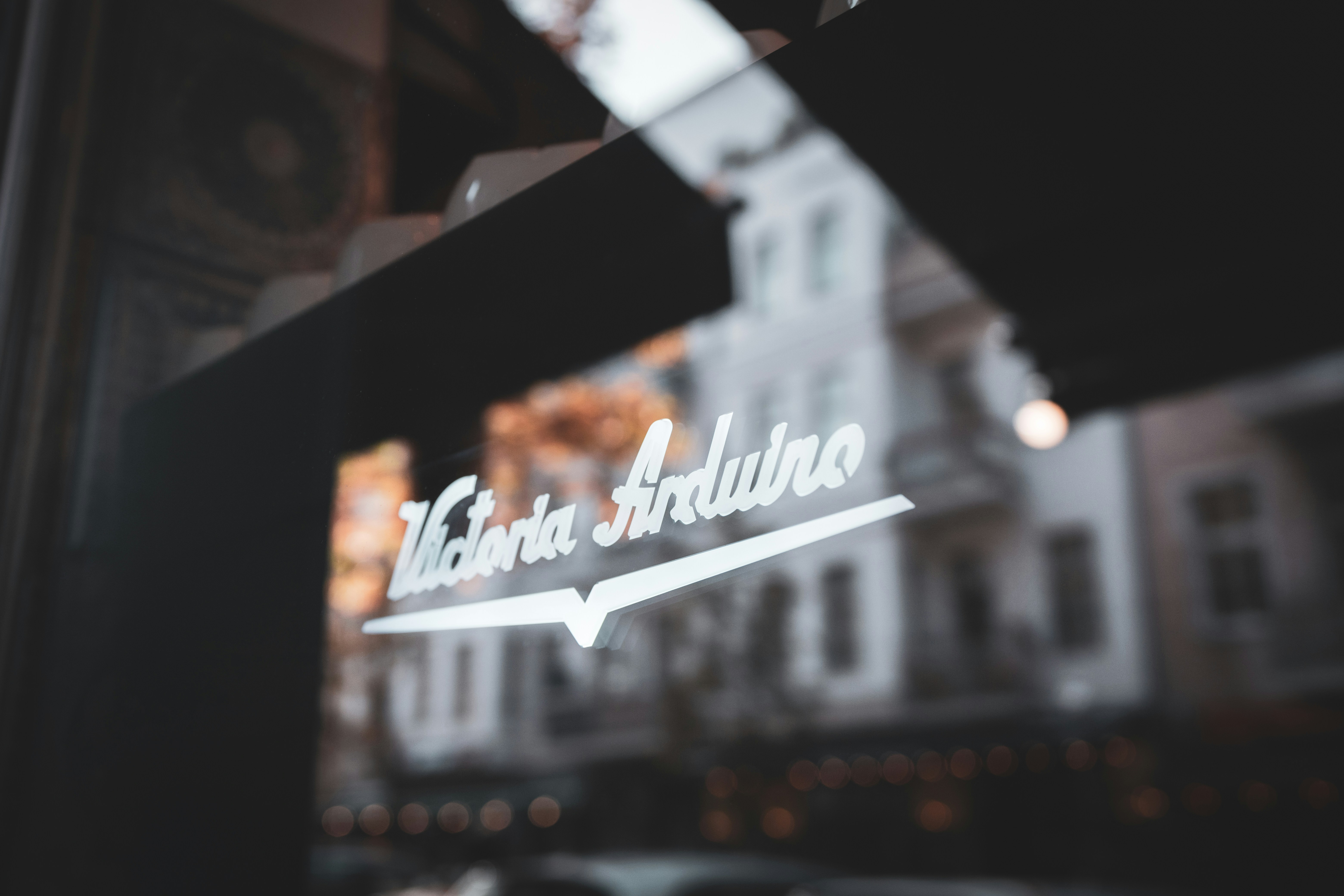 a close up of a store window with a building in the background