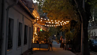Evening ambiance outside Weston Bistrot at Sela Gallery with subtle golden lighting inviting guests in.