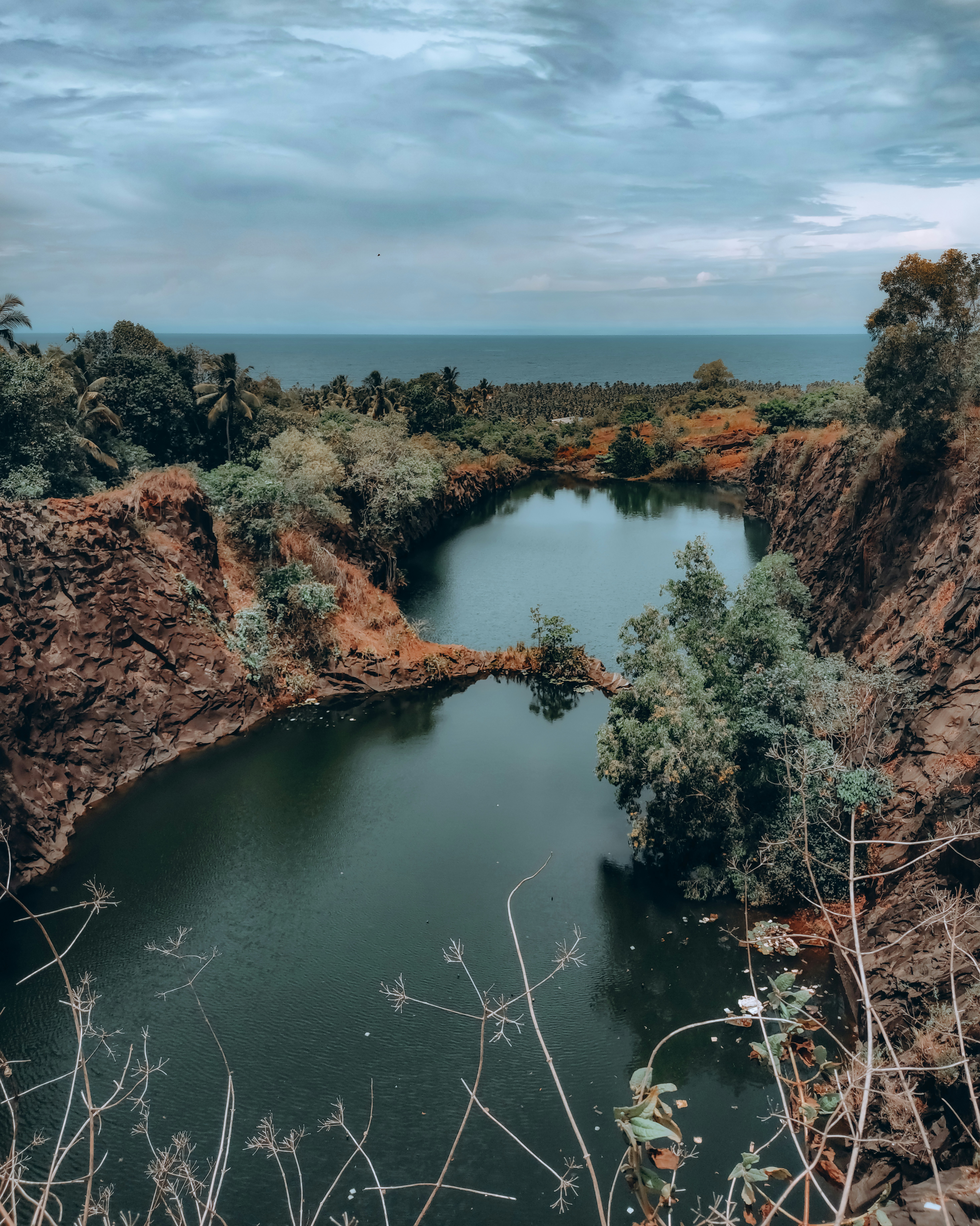 a large body of water surrounded by trees