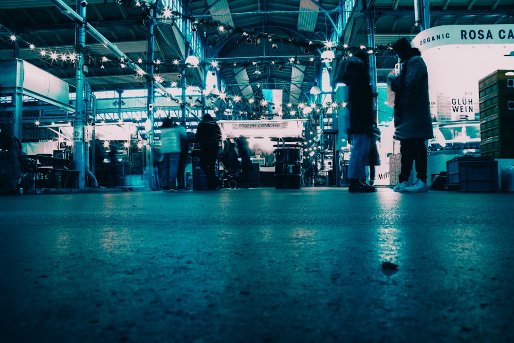 a group of people standing in a building