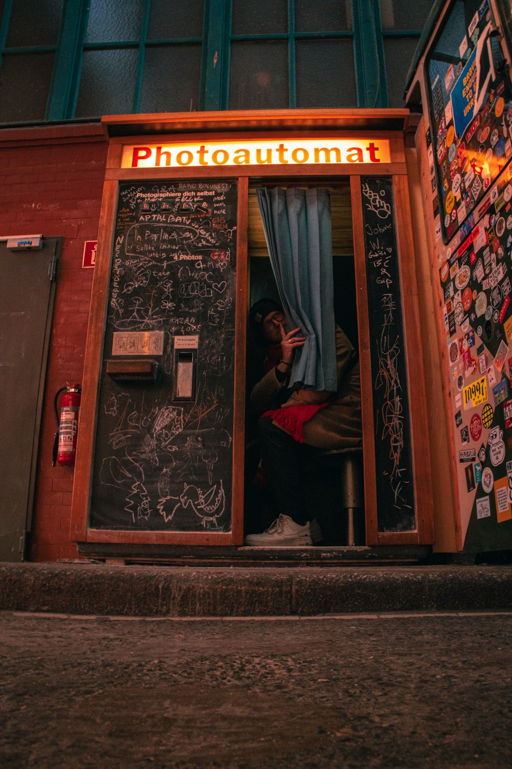 a man sitting in a doorway of a building