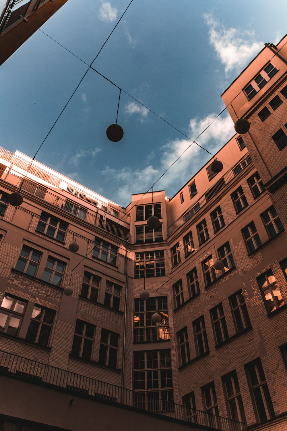 a view of a building from the ground looking up at the sky