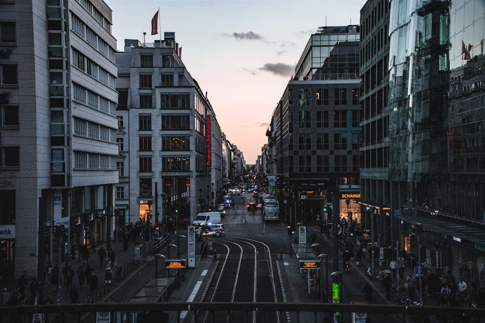 a city street filled with lots of tall buildings