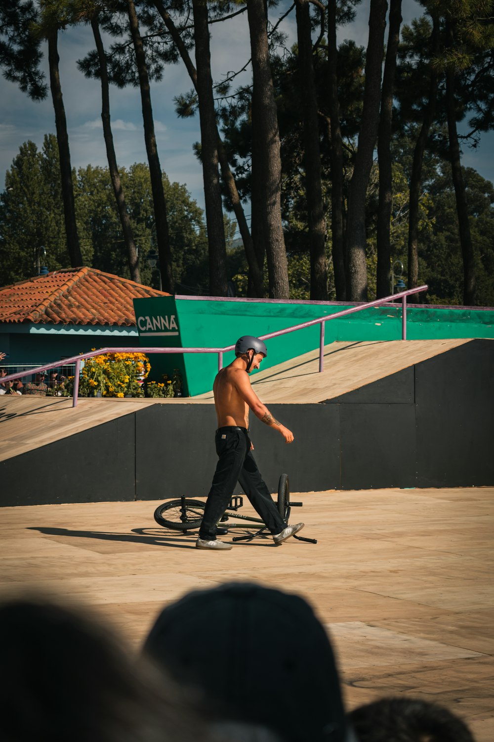 a man riding a skateboard on top of a wooden ramp