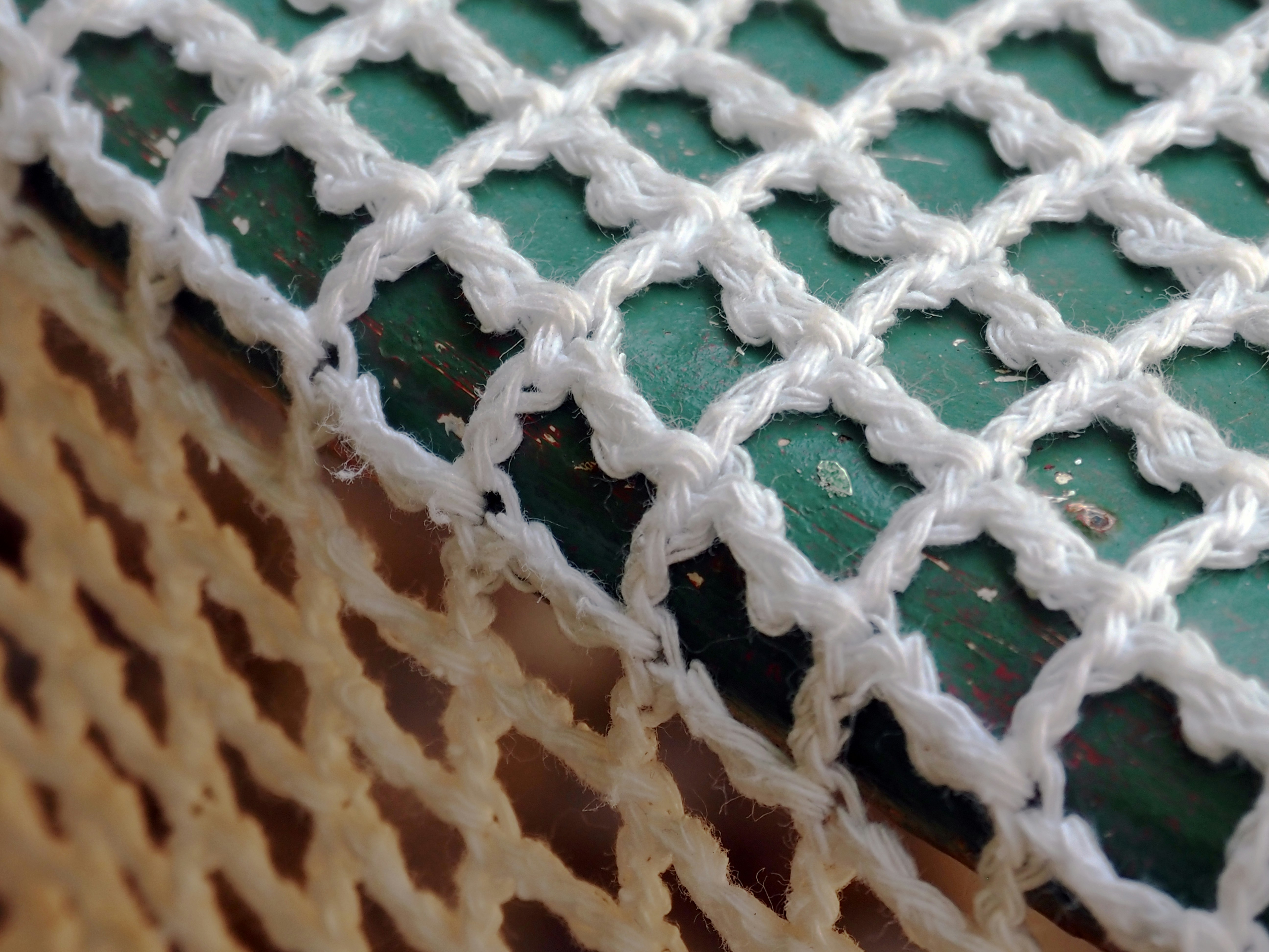 Green and white handwoven textile close-up