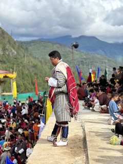 Chanchal, the ruler, standing thoughtfully near the event stage, a hint of hope in his eyes.