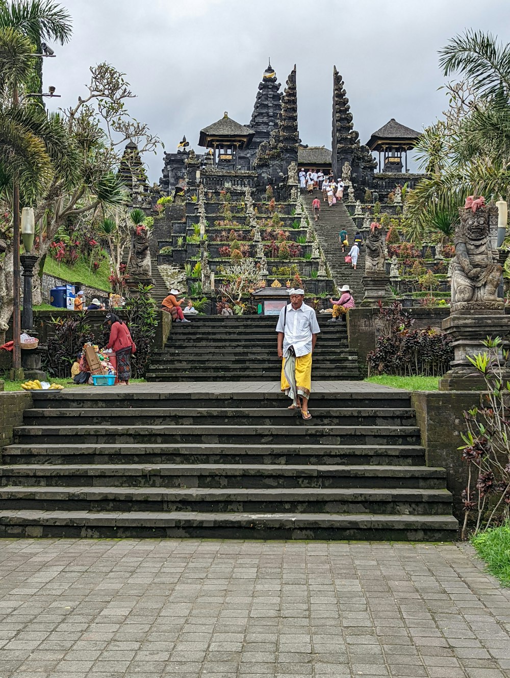 a man walking up some steps in front of a building