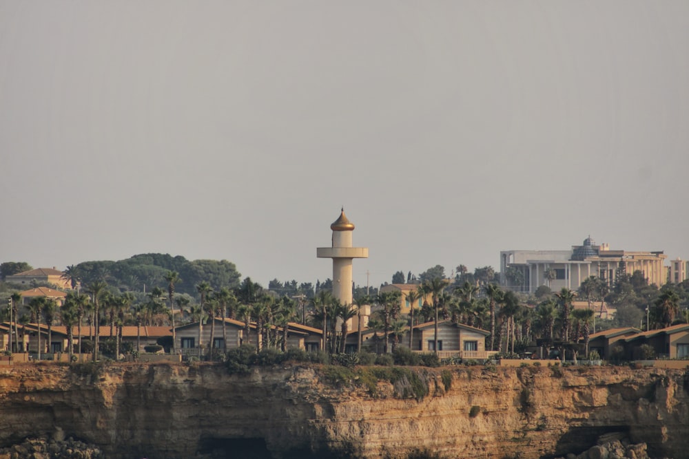 a lighthouse on the edge of a cliff
