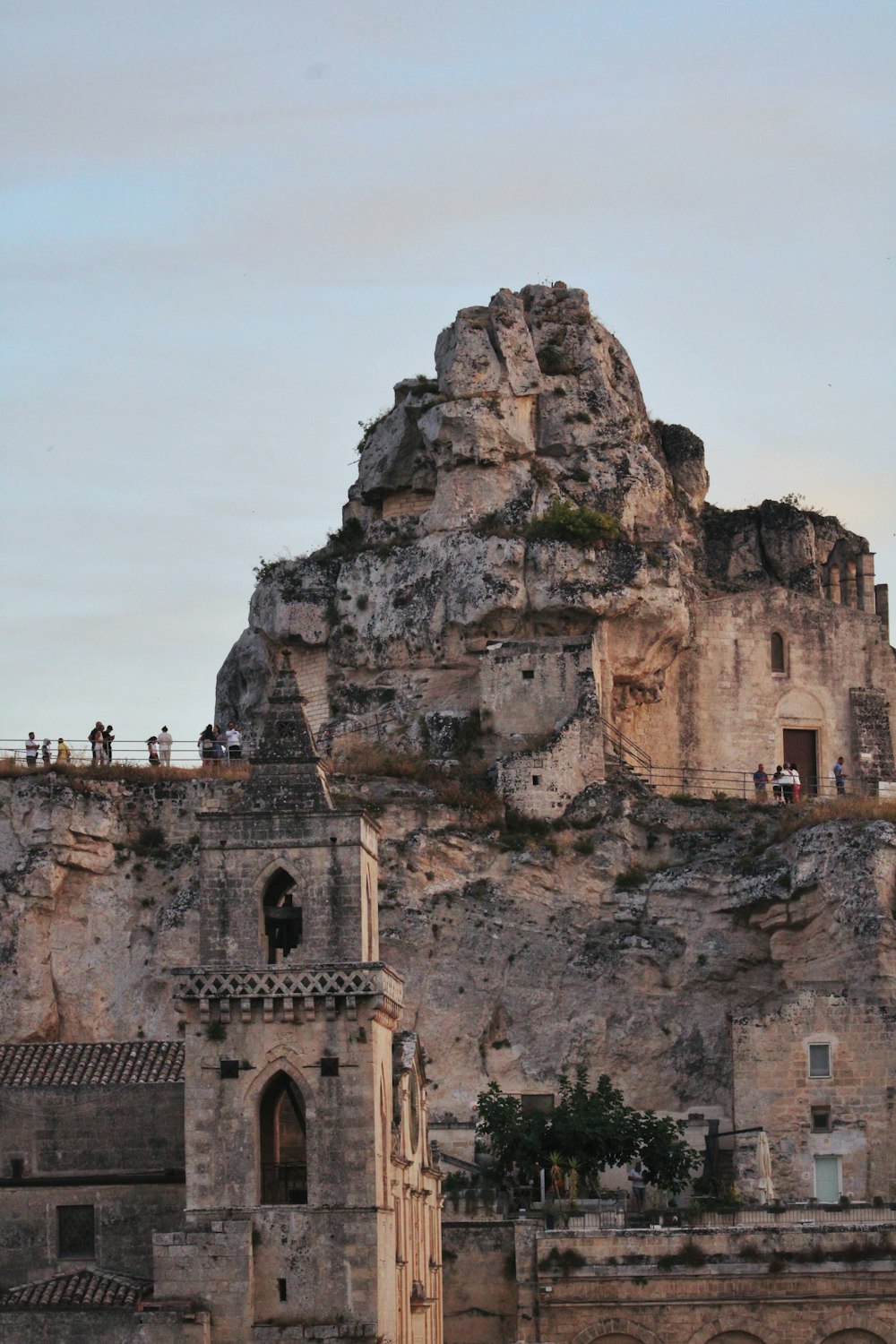 a group of people standing on top of a mountain