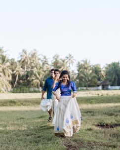 A team of evangelists walking through a rural village, warmly greeting locals.
